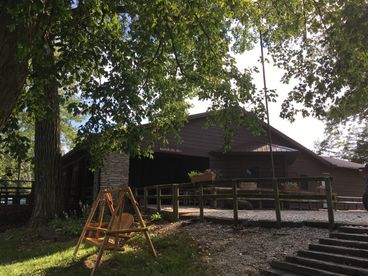 Retreat house with swing in foreground